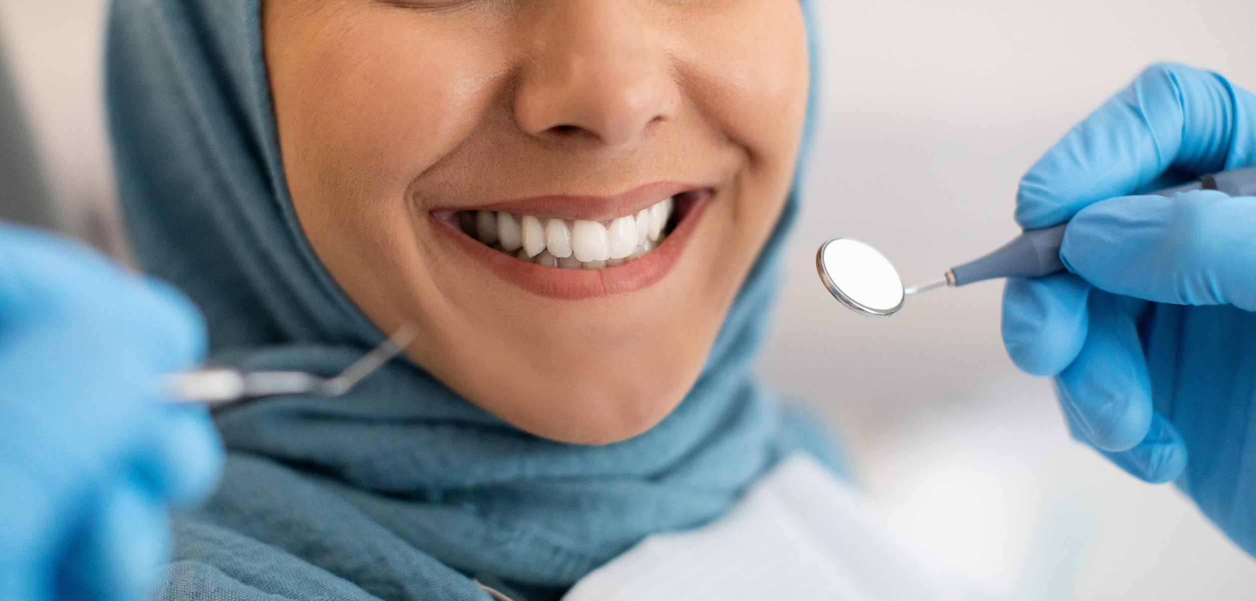 Smile Makeover. Closeup of Smiling Woman in Hijab during Dental Check up